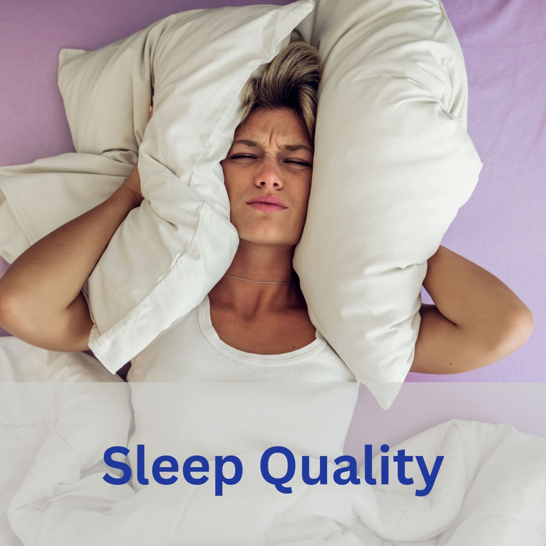 women pressing her head with pillow due to frustration of not sleeping well