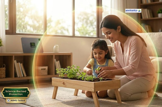 "Indian mother and daughter gardening indoors with protected technology, featuring an Envirochip-enabled tablet and an AIIMS-Tested Science-Backed Protection badge for EMF safety.
